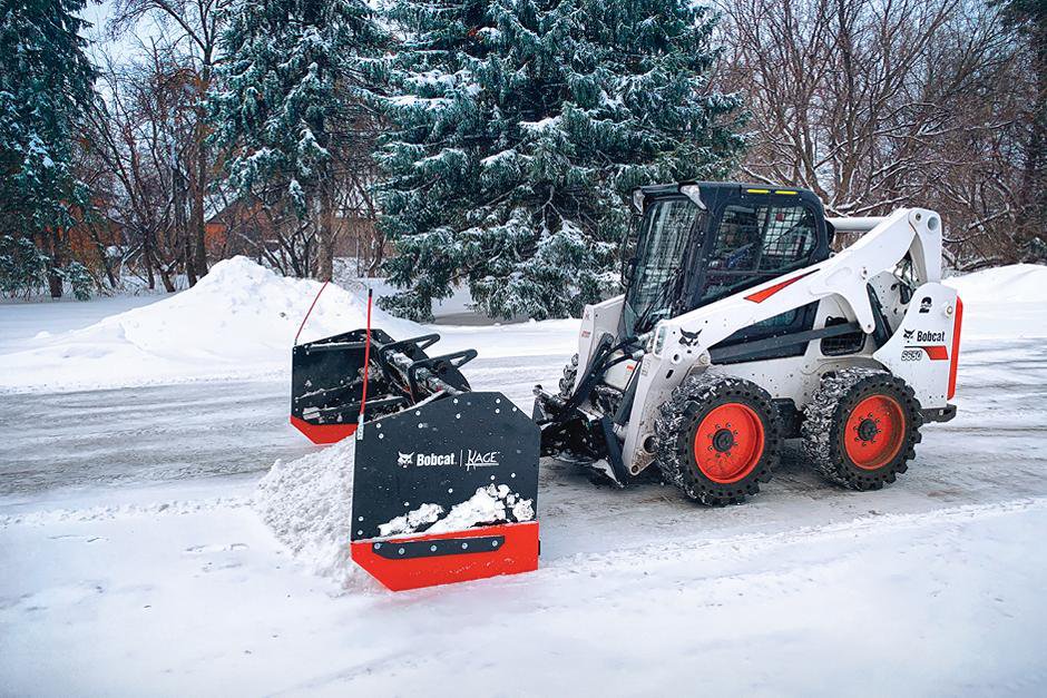 Skid steer clearing snow for residential snow removal service